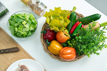 arrangement of fruits, vegetables and a whisk on the kitchen on white table. Flat lay, ready Copyspace for text. Concept of food preparation, kitchen healthy and vegetarian foods background.