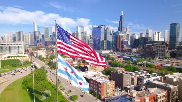 Panoramic shot of Chicago downtown above the highway with American flag.