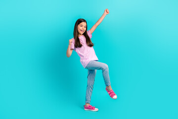 Full body photo of funky little model schoolgirl fists up hooray wear pink t-shirt jeans trendy...