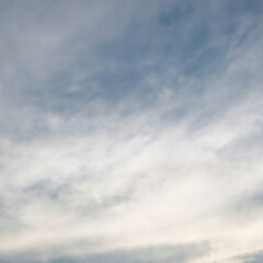 Blue sky with white clouds as a background.