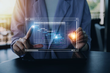 Analyst working with computer in Business Analytics and Data Management System to make report with...