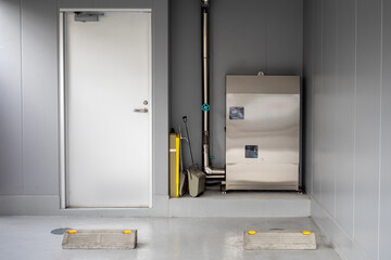 Boiler equipment. Basement business center. Wall with door. Heating technologies. Boiler equipment...