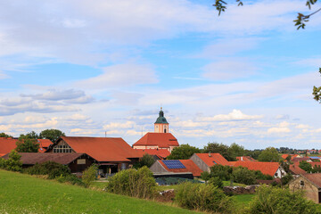 The church of Saint Nicholas in the municipality of Reichling in Bavaria under a slightly cloudy sky