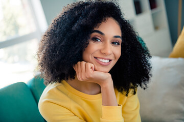 Close up photo of gorgeous lovely young lady arm touch face beaming smile spend pastime apartment...