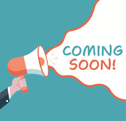 Coming soon - Male hand holding megaphone. Loudspeaker. Banner for business, marketing and advertising. Vector illustration