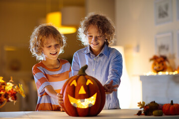 Family carving pumpkin for Halloween