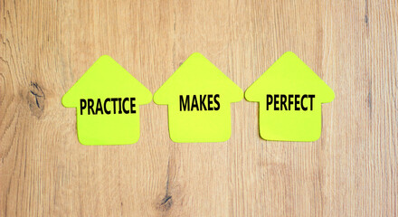 Practice makes perfect symbol. Concept words Practice makes perfect on beautiful yellow paper...