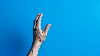 hand reaching up on blue