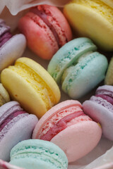 Top view Set Beautiful colorful French macaroons and flowers. Spring Flat lay white background