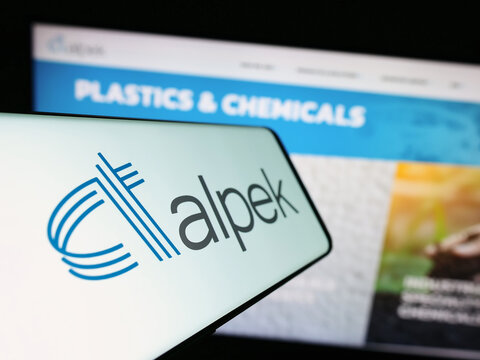 Stuttgart, Germany - 08-01-2023: Smartphone with logo of Mexican chemical company Alpek S.A.B. de C.V. on screen in front of website. Focus on center-left of phone display.