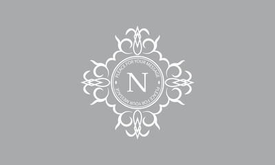 Elegant, classic vector logo with letter N in the center and space for text. Can be used for jewelry, beauty and fashion industries. Suitable for monogram, invitation, card, menu, background.