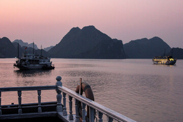 boat at sunset at halong bay, Vietnam