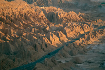 Wind-eroded hills line the road from Calama to San Pedro de Atacama, the Paso de Jama Highway in...