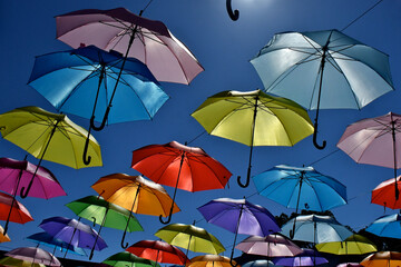 Fototapeta na wymiar Colorful parasols dance under the sun