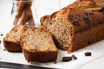Sliced moist banana bread with oats and dark chocolate chunks