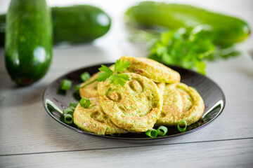 Fried squash green pancakes in a plate.