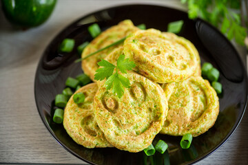 Fried squash green pancakes in a plate.