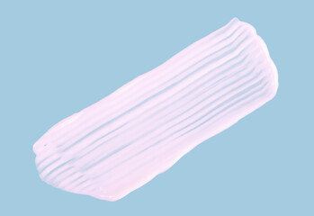 Smear of white cosmetic cream on light blue background