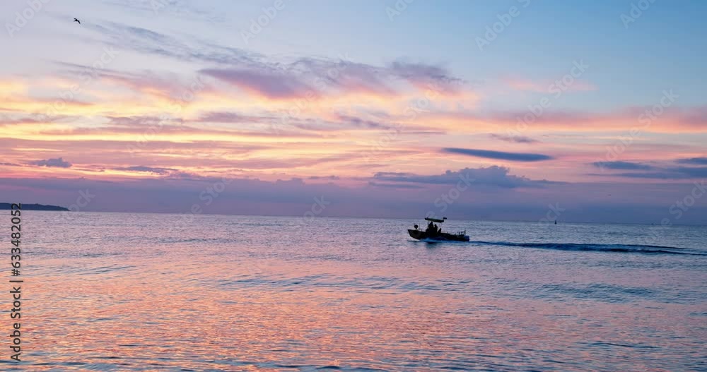 Poster summer sea sunrise and sailing patrol or fishing motor boat early in the morning sail on the sea wat