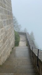 Staircase descending into foggy nothing - 633482094