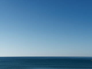 Empty calm Mediterranean sea and empty blue sky - Powered by Adobe
