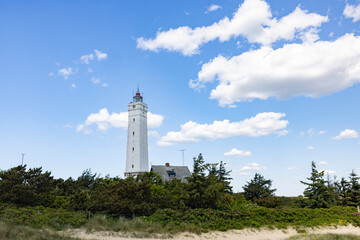 Fototapeta na wymiar The western most point of Denmark-Blåvand lighthouse on Blåvandshuk with beach view on the west coast of Jutland, Blåvand is a town in Varde municipality in Jutland in Denmark
