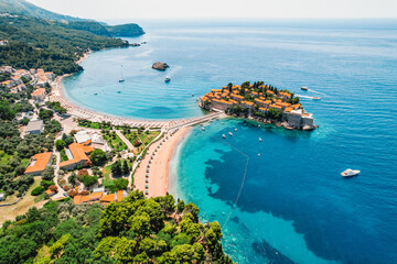 Beautiful beach and Sveti Stefan island near Budva, Montenegro. Luxury resort at Adriatic sea.