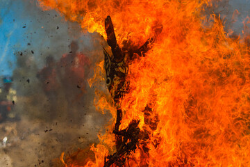 Burning of masks on Saturday of glory of Holy Week celebrated by the Yaqui community or tribe in Hermosillo Mexico on April 15, 2017. masks with strange shapes or demons burn the flames or fire. - obrazy, fototapety, plakaty