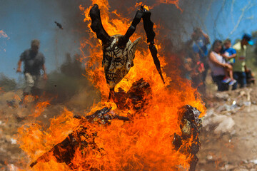 Burning of masks on Saturday of glory of Holy Week celebrated by the Yaqui community or tribe in Hermosillo Mexico on April 15, 2017. masks with strange shapes or demons burn the flames or fire