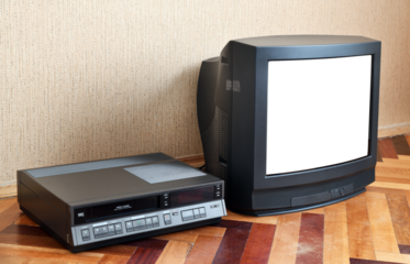 Old TV with a white screen and a VCR on the background of the wallpaper.
