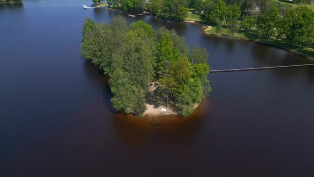 Spectacular aerial top view flight drone. Summer Paradise Wooded Island in Lake
