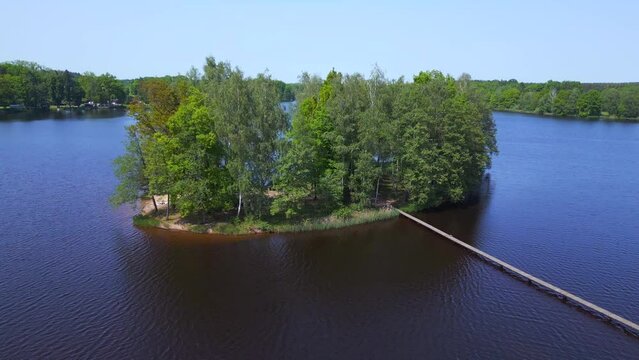 wooden walkway aerial view flight drone. Summer Paradise Wooded Island in Lake