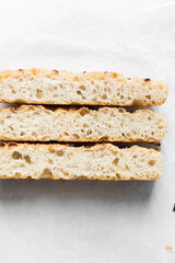 Top view of homemade onion focaccia on a white background, Flatlay of focaccia with red onion topping, fresh homemade focaccia bread