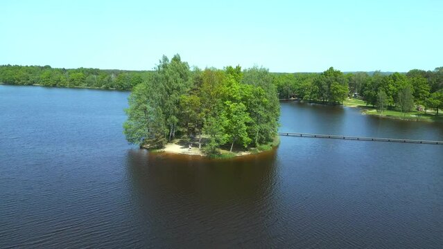 Magic aerial top view flight drone. Summer Paradise Wooded Island in Lake