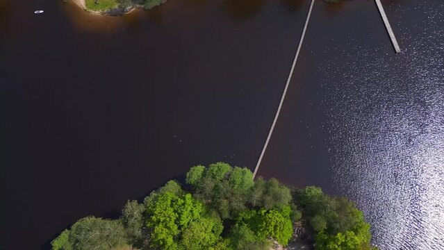 Amazing aerial top view flight drone. Summer Paradise Wooded Island in Lake