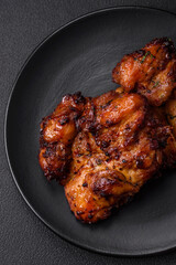 Delicious baked chicken meat with salt, spices and herbs