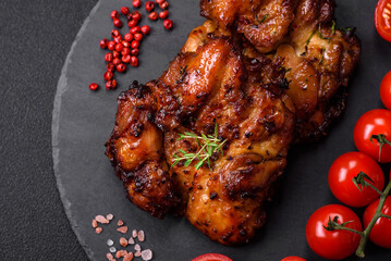 Delicious baked chicken meat with salt, spices and herbs