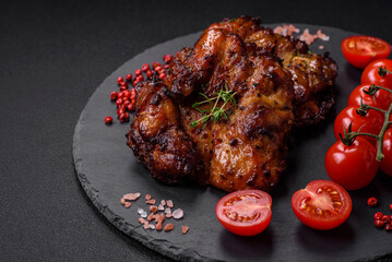Delicious baked chicken meat with salt, spices and herbs