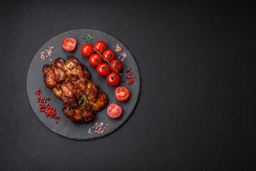 Delicious baked chicken meat with salt, spices and herbs