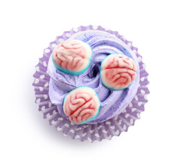 Delicious Halloween cupcake with candies on white background