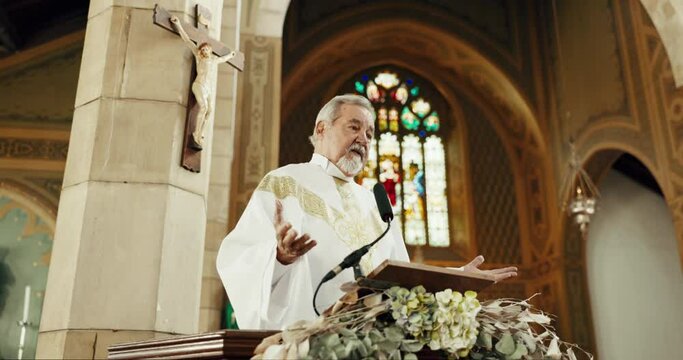Religion, priest and man preaching in church for sermon, heaven and gospel of God. Senior pastor, spiritual leadership and speech for worship, holy spirit and community prayer service of Jesus Christ