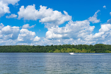 summer landscape with river, road and clouds in the blue sky