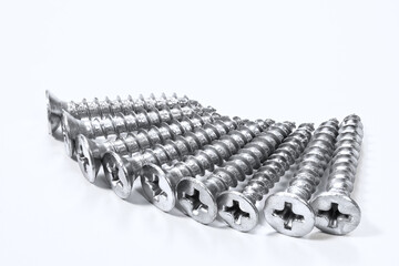 Chrome industrial steel screws in sequence.