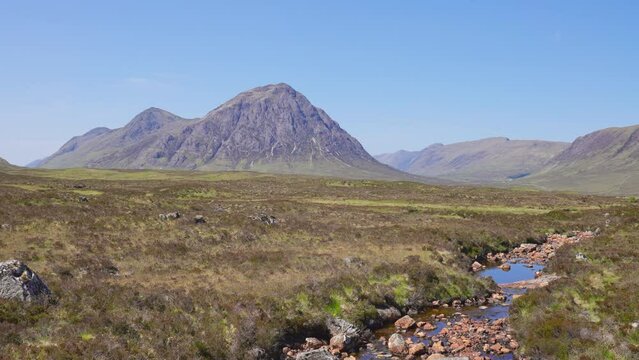 Idyllic scenery with Buachaille Etive Mor mountain and stream in Scottish Highlands, Glenecoe, Scotland