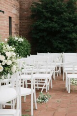 Fototapeta na wymiar white chairs and flowers on a patio