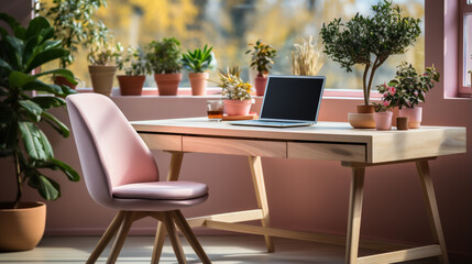 home office table with laptop and plant