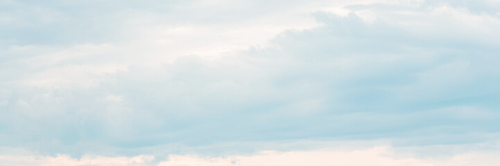 Beautiful sky background with clouds. Scenic cloudscape. Wide panoramic background for design.