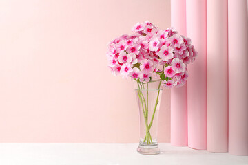 Home interior with decor elements, beautiful phlox flowers in a vase on a light background, abstract flower composition, still life with place for text, floral card for birthday, wedding, 