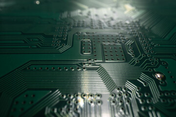 Circuit board. Technological electronic plate with roads and other components, selective focus. Technology background, electronics texture.