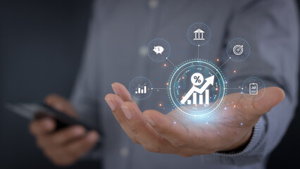 Interest rate and dividend concept. Businessman show percentage symbol and up arrow on hand, Interest rates continue to increase, return on stocks and mutual funds, long term investment for retirement